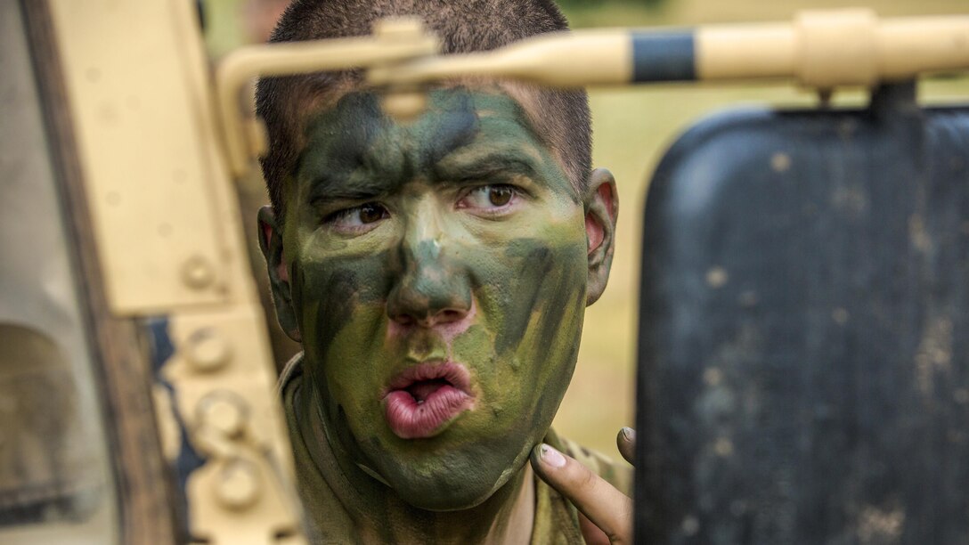 A soldier applies face paint to prepare for a live-fire training event as part of exercise Saber Guardian 17 in Koren, Bulgaria, July 15, 2017. Saber Guardian is a U.S. Army Europe-led, multinational exercise that spans across Bulgaria, Hungary and Romania with more than 25,000 participating troops from 22 allied and partner nations. Army photo by Spc. Winterlyn Patterson