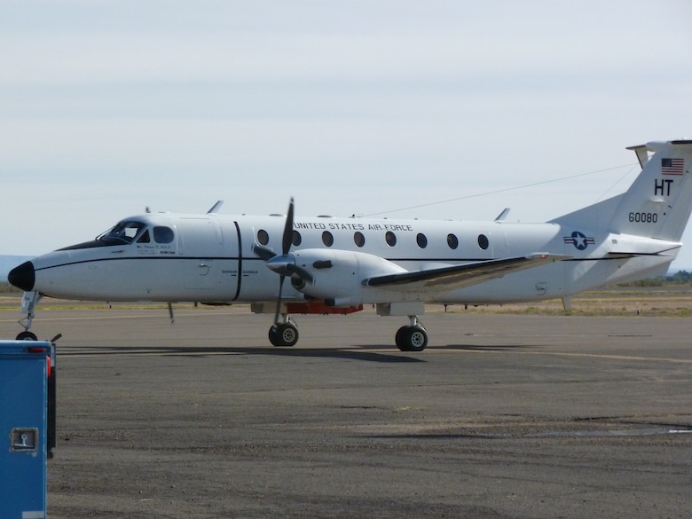 A United States Air Force aircraft, fitted with Locata antenna and receiver, taxies at Alamogordo Airport before taking off to test the performance of the Locata network installed at the White Sands Missile Range, New Mexico. The Air Force Institute of Technology was chosen by the 746th Test Squadron to partner with the Locata Corporation through a Cooperative Research and Development Agreement to develop a highly accurate navigation system for testing methods developed for overcoming GPS jamming, or electronic warfare. This collaboration allowed AFIT to provide research and government expertise for updating Locata’s system. The updates included new antennas for aviation use, amplifying the Locata transmitter signals for longer ranges and determining the additional dynamics associated with aircraft, such as speed, maneuverability and tropospheric variation adjustments. (Courtesy Photo/Locata Corporation)