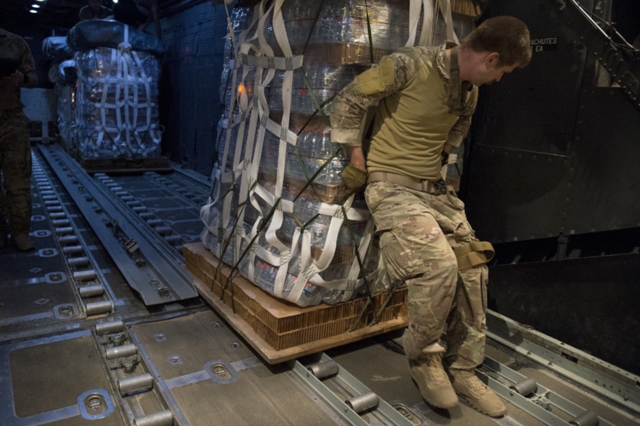A U.S. Air Force MC-130 crew prepares for a resupply airdrop over Syria, June 22, 2017. Air Force photo by Master Sgt. Jason Robertson