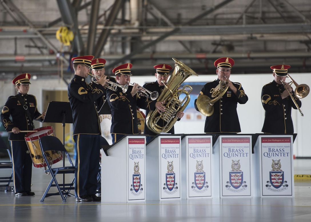 The U.S. Army Brass Quintet performs during the U.S. Army Priority Air Transport Command change of command and responsibility ceremony at Joint Base Andrews, Md., July 14, 2017. The role of commander was passed from Lt. Col. Heather L. Maki to Lt. Col. Matthew L. Rowland during the event. Change of command ceremonies are symbolic of the transfer of command responsibility and the lasting continuity of the unit’s mission. (U.S. Air Force photo by Senior Airman Jordyn Fetter)