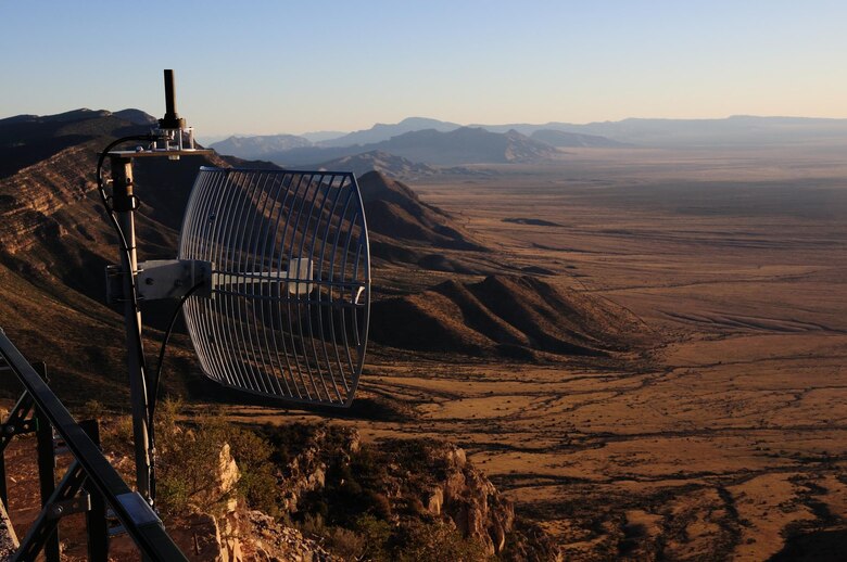 A LocataLite transmitter, high on a peak for maximum range, transmits high-accuracy positioning signals across the White Sands Missile Range, New Mexico. The Air Force Institute of Technology was chosen by the 746th Test Squadron to partner with the Locata Corporation through a Cooperative Research and Development Agreement to develop a highly accurate navigation system for testing methods developed for overcoming GPS jamming, or electronic warfare.  This system is tested on equipment, such as aircraft or land-based vehicles that are used in locations where electronic warfare prevents the warfighter from using GPS in battle. The collaboration allowed AFIT to provide research and government expertise for updating Locata’s system to meet the requirements developed by the 746th Test Squadron. (Courtesy photo/Locata Corporation)