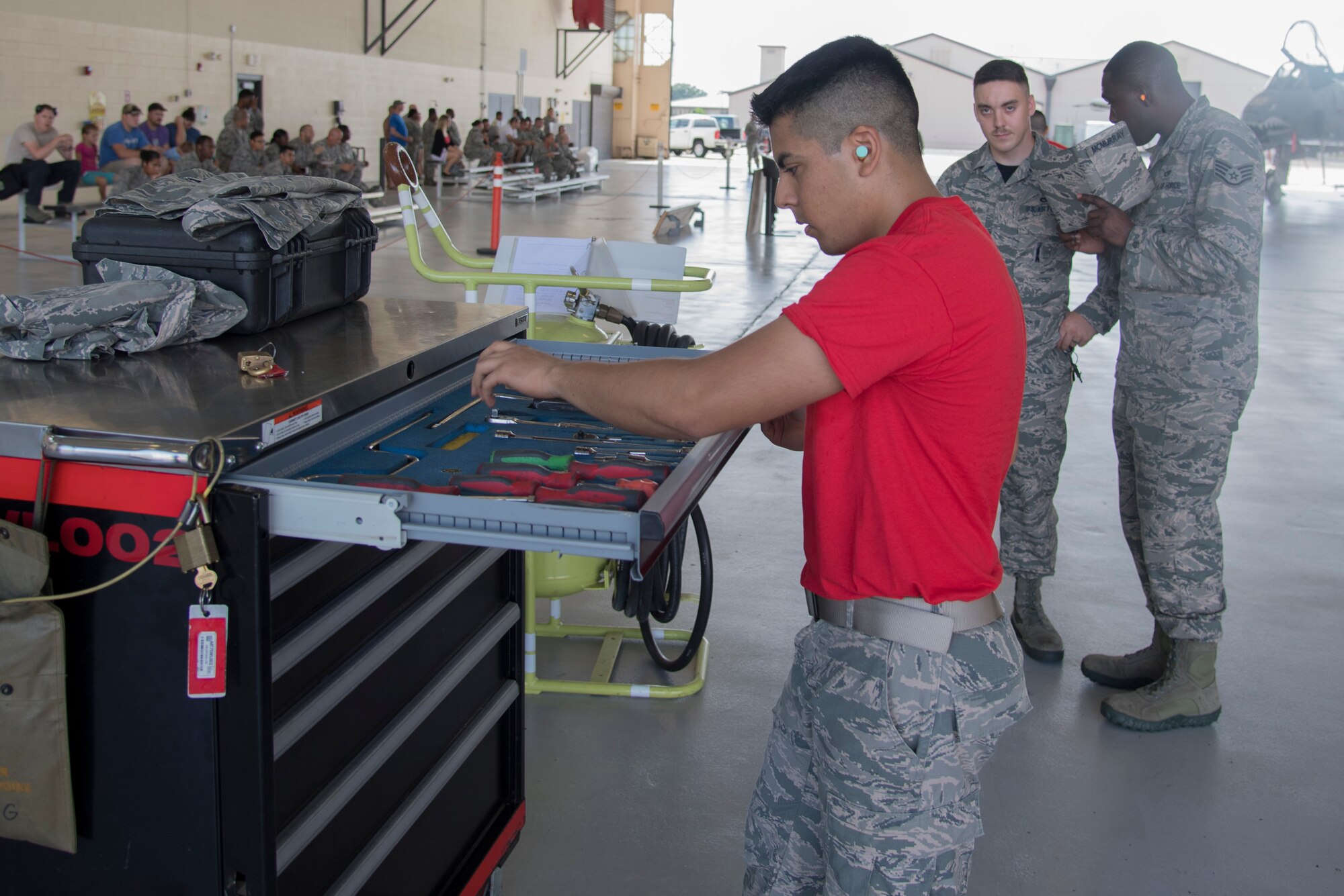 Airman 1st Class Amado Almazan, 75th Aircraft Maintenance Unit weapons load crew member, accounts for equipment during a toll box inspection as part of a weapons load competition, July 14, 2017, at Moody Air Force Base, Ga. Every quarter members of the 74th and 75th AMU competes in the quarterly competition that tests knowledge, dress and appearance, and speed of loading a GBU-12 joint direct attack munition and AIM-9 Sidewinder. (U.S. Air Force photo by Staff Sgt. Eric Summers Jr.)