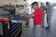 Airman 1st Class Amado Almazan, 75th Aircraft Maintenance Unit weapons load crew member, accounts for equipment during a toll box inspection as part of a weapons load competition, July 14, 2017, at Moody Air Force Base, Ga. Every quarter members of the 74th and 75th AMU competes in the quarterly competition that tests knowledge, dress and appearance, and speed of loading a GBU-12 joint direct attack munition and AIM-9 Sidewinder. (U.S. Air Force photo by Staff Sgt. Eric Summers Jr.)