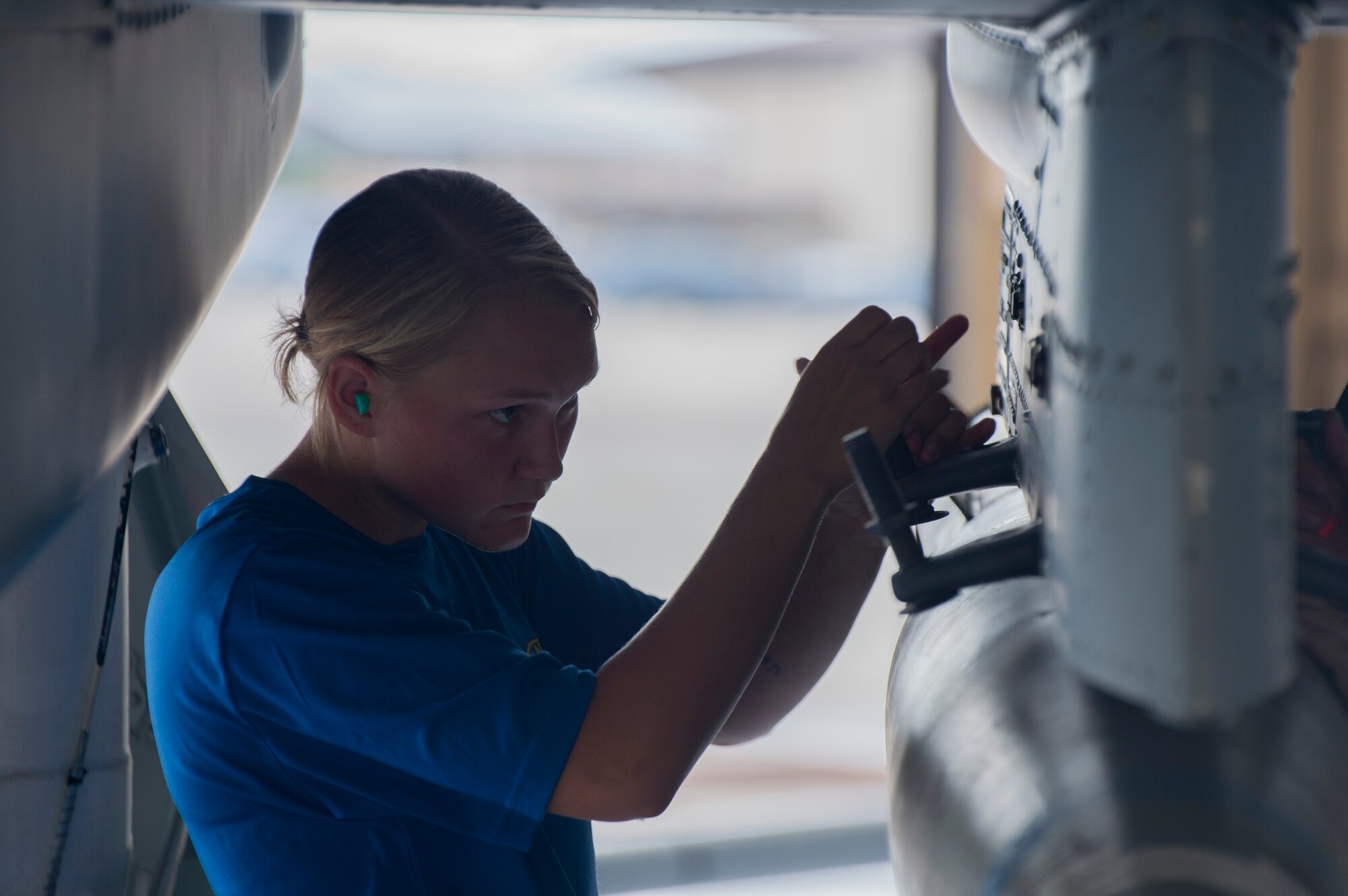 Airman 1st Class Amber Boyce, 74th Aircraft Maintenance Unit weapons load crew member, hand-tightens a bolt to secure a GBU-12 joint direct attack munition to an A-10C Thunderbolt II during weapons load competition, July 14, 2017, at Moody Air Force Base, Ga. Every quarter members of the 74th and 75th AMU competes in the quarterly competition that tests knowledge, dress and appearance, and speed of loading a GBU-12 joint direct attack munition and AIM-9 Sidewinder. (U.S. Air Force photo by Staff Sgt. Eric Summers Jr.)