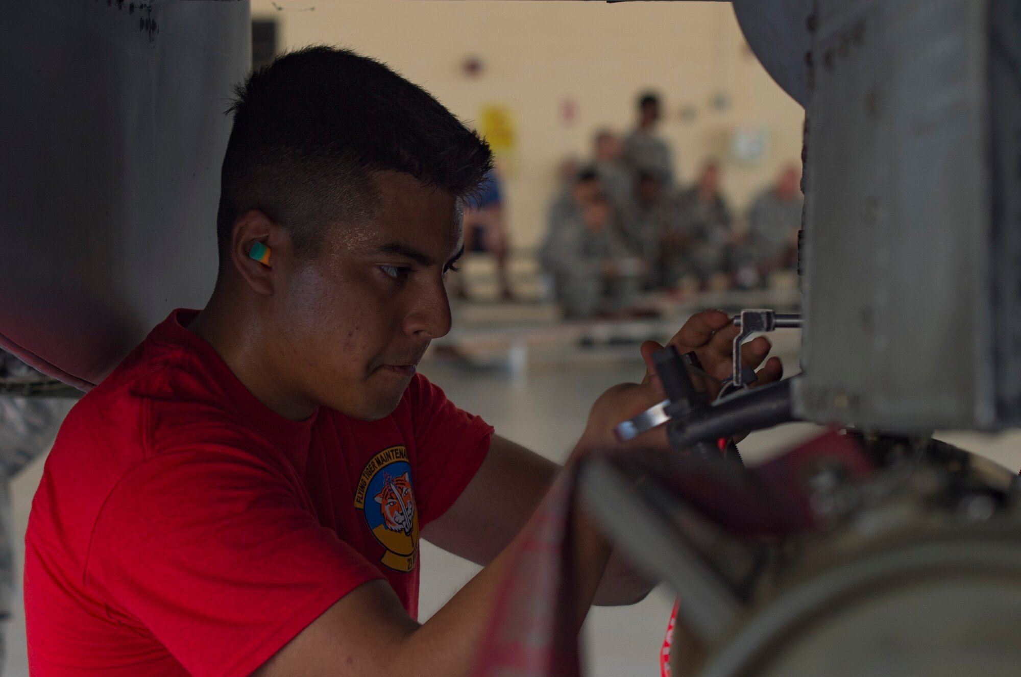 Airman 1st Class Amado Almazan, 75th Aircraft Maintenance Unit weapons load crew member, uses a wrench to secure a GBU-12 joint direct attack munition to an A-10C Thunderbolt II during the weapons load competition, July 14, 2017, at Moody Air Force Base, Ga. Every quarter members of the 74th and 75th AMU competes in the quarterly competition that tests knowledge, dress and appearance, and speed of loading a GBU-12 joint direct attack munition and AIM-9 Sidewinder. (U.S. Air Force photo by Staff Sgt. Eric Summers Jr.)