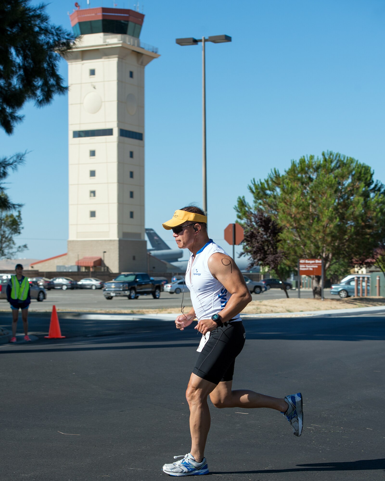 U.S. Air Force Col. Hank Lau, 60th Aerospace Medicine Squadron, competes in the run portion of the Travis Triathlon at Travis Air Force Base, Calif., July 15, 2017. Over 25 participants competed in the triathlon which consisted of a 400 meter swim, 12 mile bike ride and a 5K run. (U.S. Air Force photo by Louis Briscese)