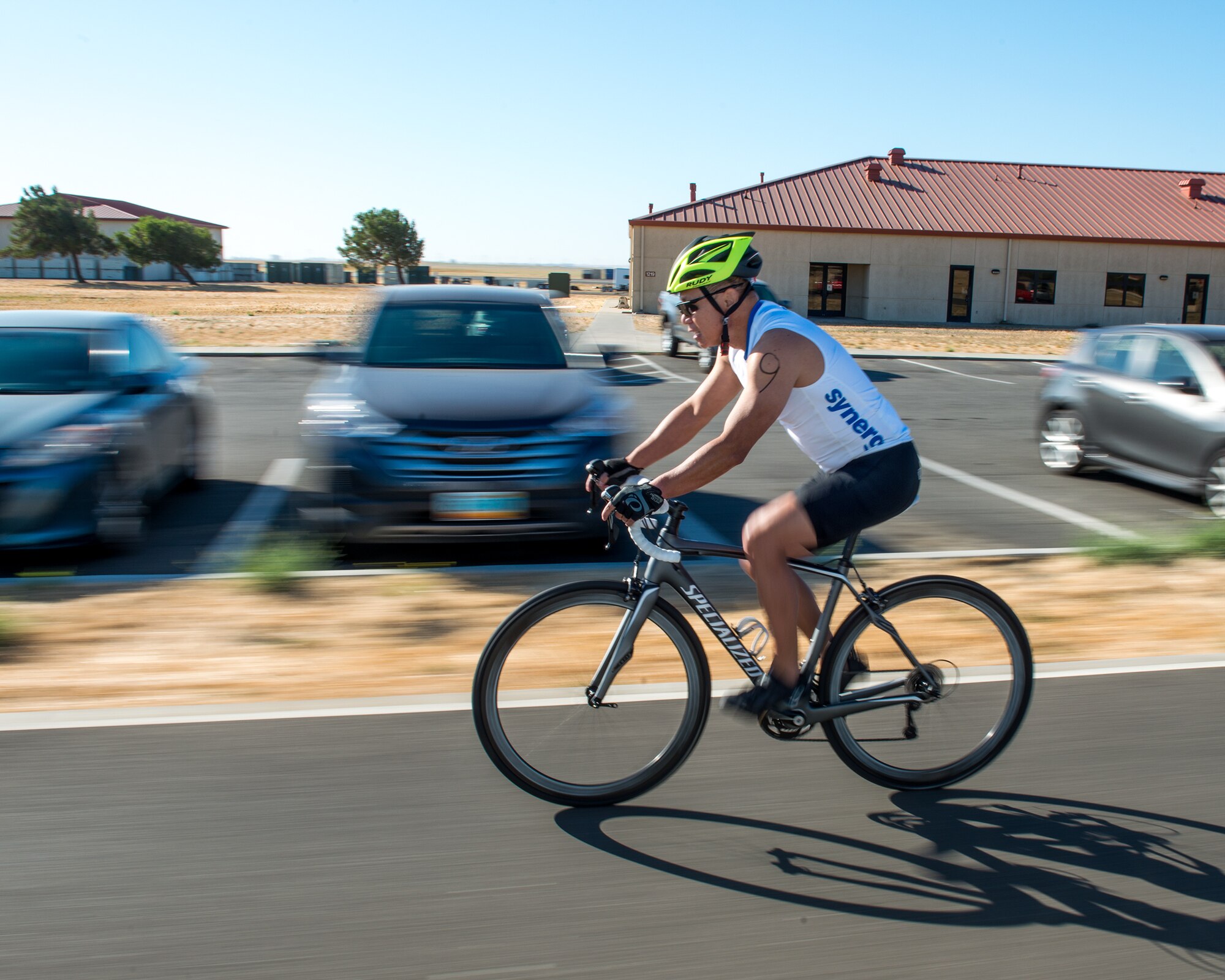 U.S. Air Force Col. Hank Lau, 60th Aerospace Medicine Squadron, competes in the bike portion of the Travis Triathlon at Travis Air Force Base, Calif., July 15, 2017. Over 25 participants competed in the triathlon which consisted of a 400 meter swim, 12 mile bike ride and a 5K run. (U.S. Air Force photo by Louis Briscese)