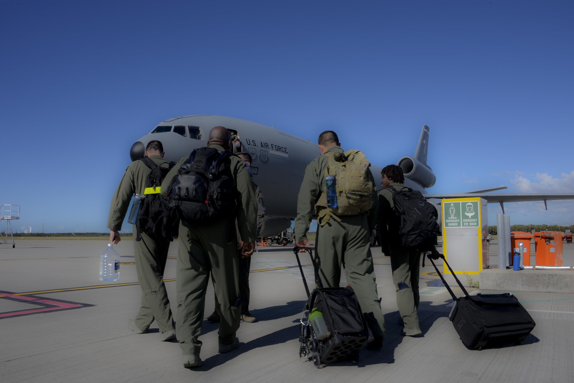 Aircrew from the 6th and 9th Air Refueling Squadrons board a KC-10 Extender at Royal Australian Air Force Base Richmond in Brisbane, Australia July 14, 2017. KC-10s from Travis AFB and Joint Base McGuire-Dix-Lakehurst, New Jersey, supported Exercise Talisman Saber 2017 by executing Exercise Ultimate Reach, a strategic refueling and airdrop mission in which three KC-10s refueled five C-17 Globemaster IIIs carrying U.S. Army, Australian and Canadian paratroopers prior to an airdrop. TS17 is a biennial exercise in Australia that focuses on bilateral military training between U.S. Pacific Command forces and the Australian Defence Force to improve U.S.-Australia combat readiness, increase interoperability, maximize combined training opportunities and conduct maritime prepositioning and logistics operations in the Pacific. (U.S. Air Force photo by 2nd Lt. Sarah Johnson)