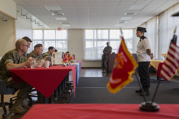 U.S. Marine Corps Lance Cpl. Erika Vargas, a food service specialist with Headquarters and Headquarters Squadron, answers questions for the judges during the Food Service Specialist of the Quarter competition at Marine Corps Air Station Iwakuni, Japan, July 13, 2017. The event prepared Marines for a larger competition July 26-27 in Okinawa. This was Vargas’ second time participating in the competition. She took first place, surpassing her placement last quarter. (U.S. Marine Corps photo by Lance Cpl. Gabriela Garcia-Herrera)