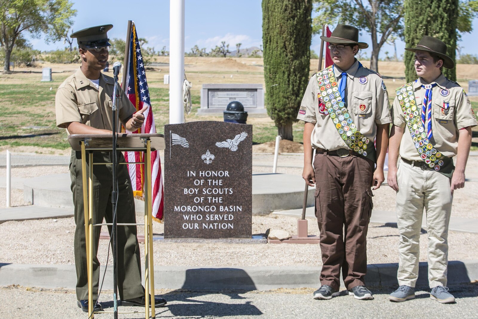 Capt. Jason Samuel, defense counsel, Legal Services Support Team, Headquarters Battalion, serves as the guest speaker at a memorial dedication ceremony for the Boy Scouts of America in Mountain Valley Memorial Park in Joshua Tree, California.