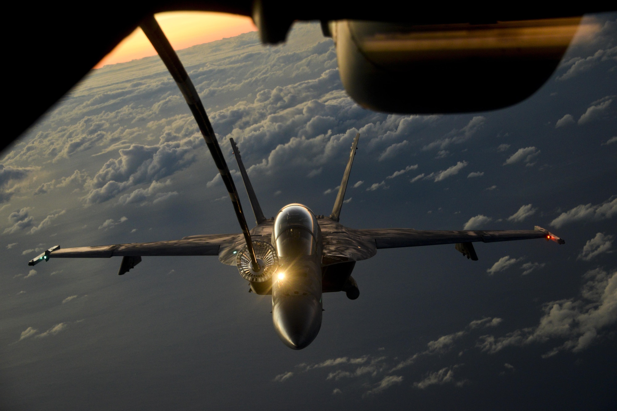 A U.S. Air Force KC-10 Extender from Travis Air Force Base, California, refuels a U.S. Navy F/A-18 Super Hornet over the Pacific Ocean July 14, 2017. KC-10s from Travis AFB supported Exercise Talisman Saber 2017 by conducting various air refueling missions over Australia. TS17 is a biennial exercise in Australia that focuses on bilateral military training between U.S. Pacific Command forces and the Australian Defence Force to improve U.S.-Australia combat readiness, increase interoperability, maximize combined training opportunities and conduct maritime prepositioning and logistics operations in the Pacific. (U.S. Air Force photo by 2nd Lt. Sarah Johnson)