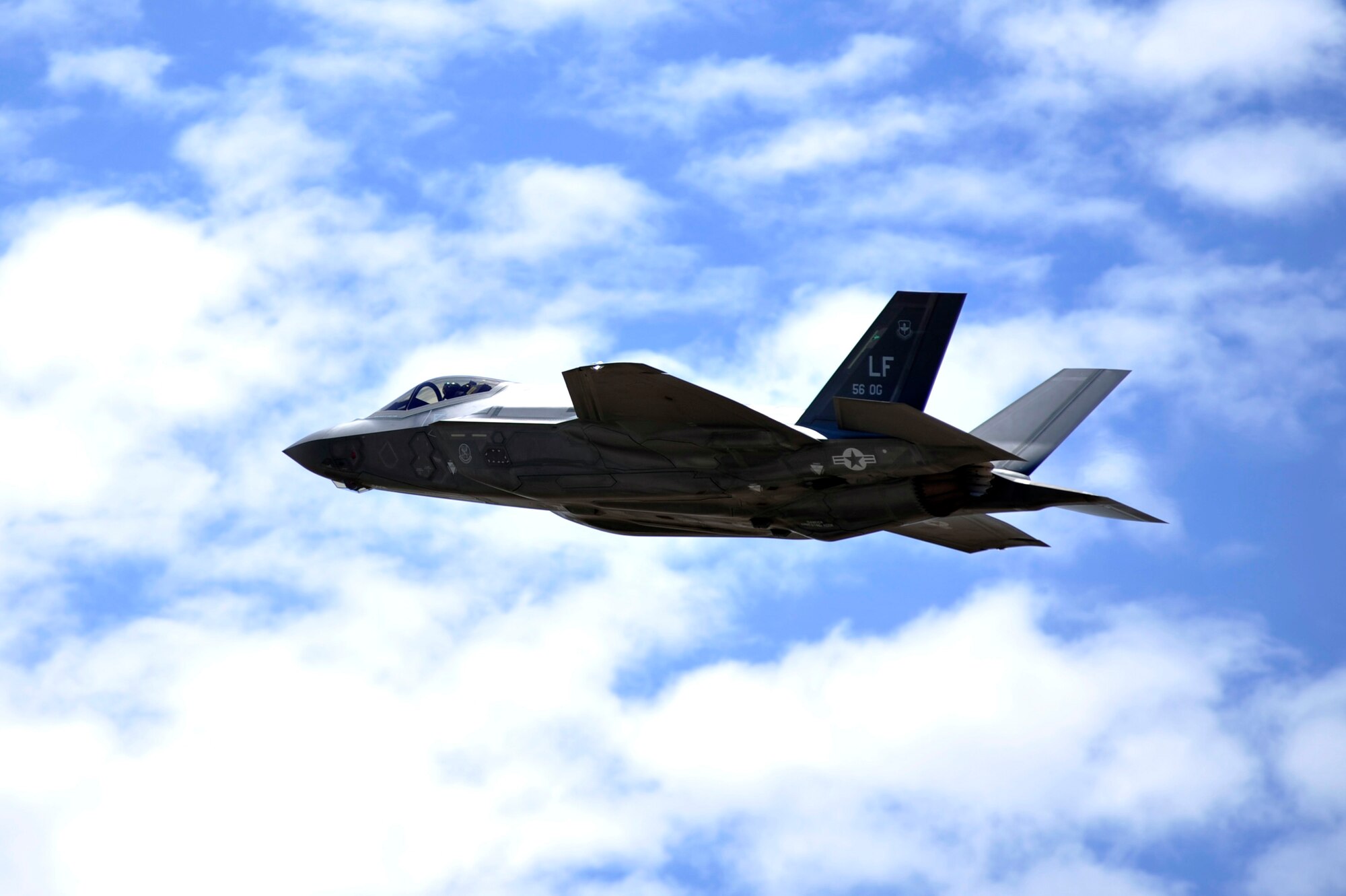An F-35A Lightning II soars through the sky July 17, 2017 at Luke Air Force Base, Ariz. The first F-35A Lightning II basic course at Luke held the capstone flight today facing F-35s against F-16 Fighting Falcons in a simulated combat environment. (U.S. Air Force photo/Airman 1st Class Pedro Mota)