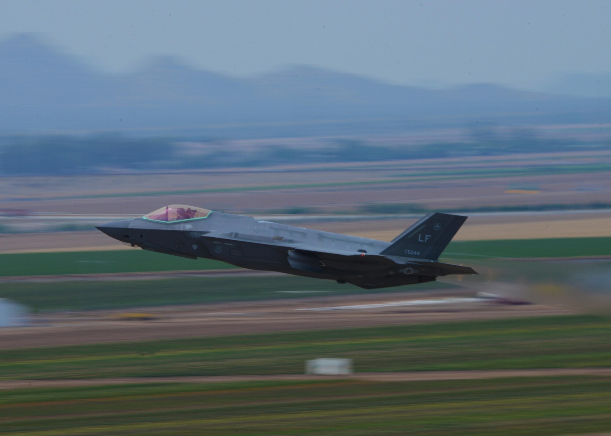 A 56th Fighter Wing F-35A Lightning II pilot takes off from Luke Air Force Base, Ariz., July 17, 2017. F-35 pilots faced off against F-16 Fighting Falcons during a capstone flight exercise as part of the first F-35 basic course at Luke. (U.S. Air Force photo/Airman 1st Class Caleb Worpel)