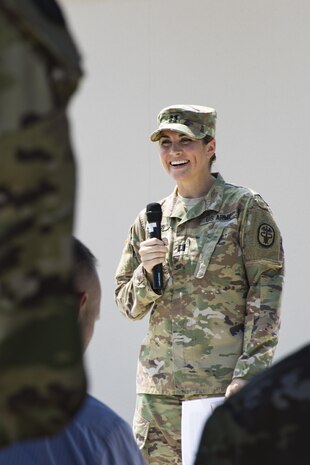 U.S. Army Capt. Monika Jones, branch chief, Iwakuni Veterinary Services, Public Health Activity Japan, gives a speech during the opening of the new veterinary clinic at Marine Corps Air Station Iwakuni, July 13, 2017. The new facility was built to accommodate the growing number of patients and military working dogs on the air station. The veterinary clinic is responsible for the welfare of hundreds of military pets and military working dogs, and the new facility allows technicians to double the amount of patients they can see. (U.S. Marine Corps photo by Cpl. Joseph Abrego)