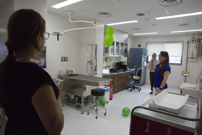 Guests tour the new facility during the veterinary clinic opening at Marine Corps Air Station Iwakuni, Japan, July 13, 2017. The facility features new upgraded medical equipment better suited for the larger number of patients on the installation. The new clinic took over a year to build and will service both military working dogs and pets. (U.S. Marine Corps photo by Sgt. N.W. Huertas)