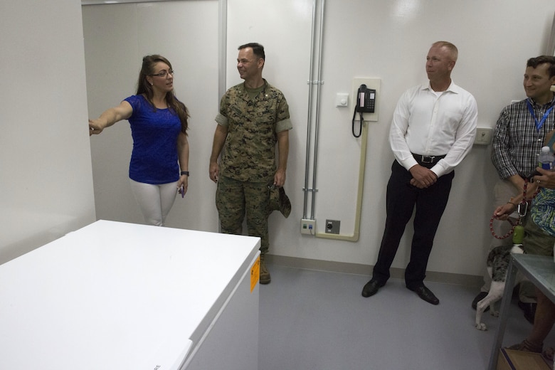 Veterinary clinic personnel showcase the new facility for guests during the opening of the veterinary clinic at Marine Corps Air Station Iwakuni, Japan, July 13, 2017. The veterinary clinic is responsible for the welfare of hundreds of military pets and military working dogs. The new facility allows technicians to double the amount of patients they can see. (U.S. Marine Corps photo by Sgt. N.W. Huertas)