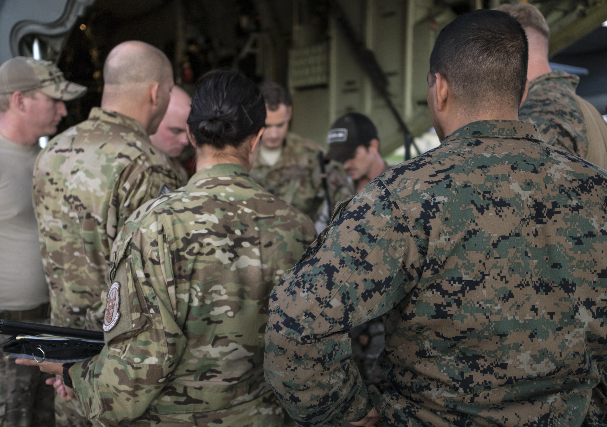 U.S. Air Force 353rd Special Operations Group and U.S. Marine Corps 3rd Reconnaissance Battalion operators conduct a jumpmaster briefing prior to high altitude, high opening (HAHO) jump operations July 11, 2017, at Rockhampton, Australia during Talisman Saber 2017. The tactical level exchanges and realistic scenario-based mission executed during the joint training exercise increased interoperability and partner capacity with between the U.S Air Force and Marine Corps. (U.S. Air Force photo by Capt. Jessica Tait)