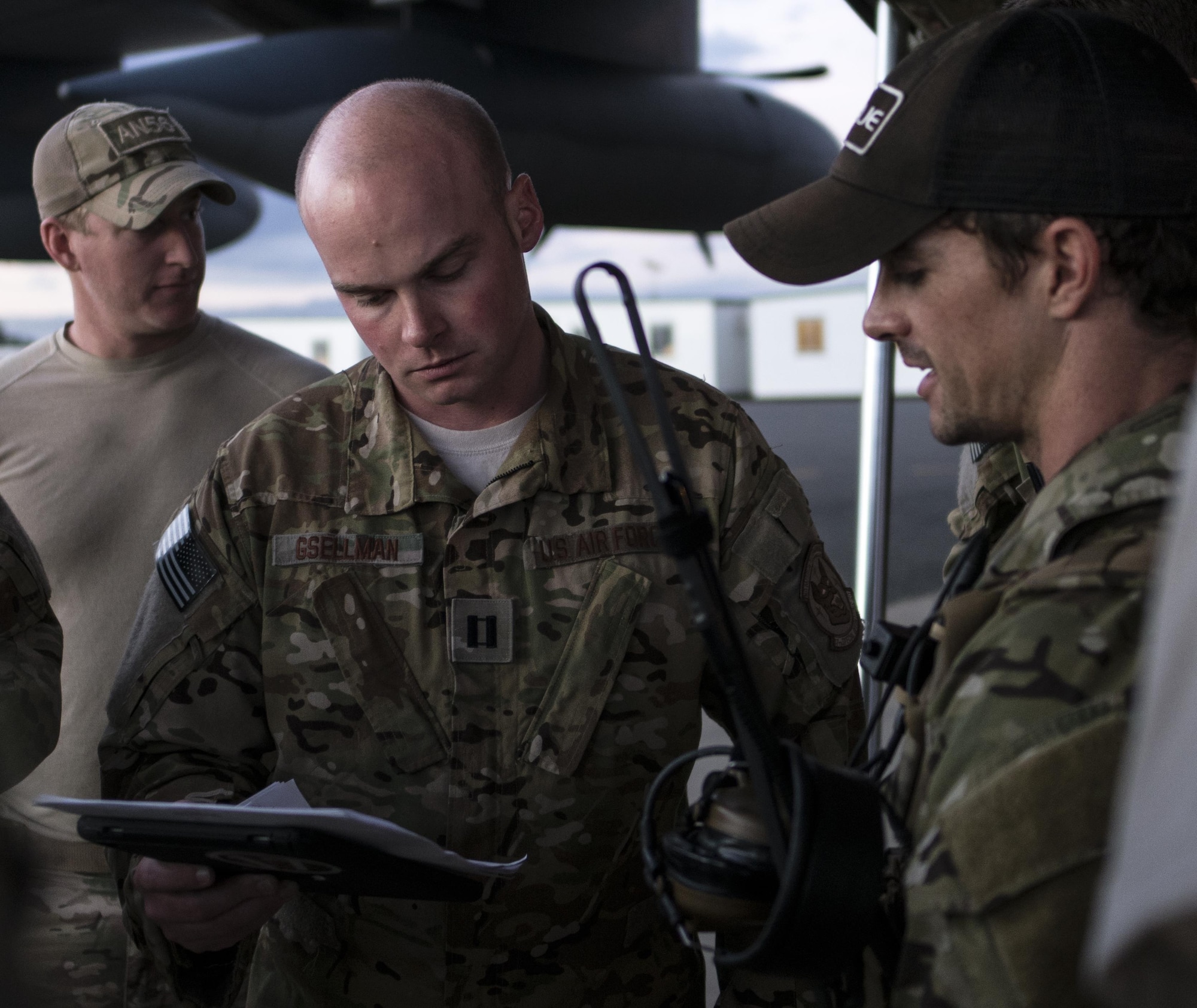 A U.S. Air Force 17th Special Operations Squadron MC-130J Commando II aircraft commander and 320th Special Tactics Squadron jumpmaster discuss the parameters for high altitude, high opening (HAHO) jump operations July 11, 2017, at Rockhampton, Australia during Talisman Saber 2017. Experts in specialized aviation, the 17th SOS executed complex personnel and cargo airdrops, low-level flying operations and dissimilar formation flights with 37th Squadron Royal Australian Air Force and 40th Squadron Royal New Zealand Air Force throughout the exercise. (U.S. Air Force photo by Capt. Jessica Tait)