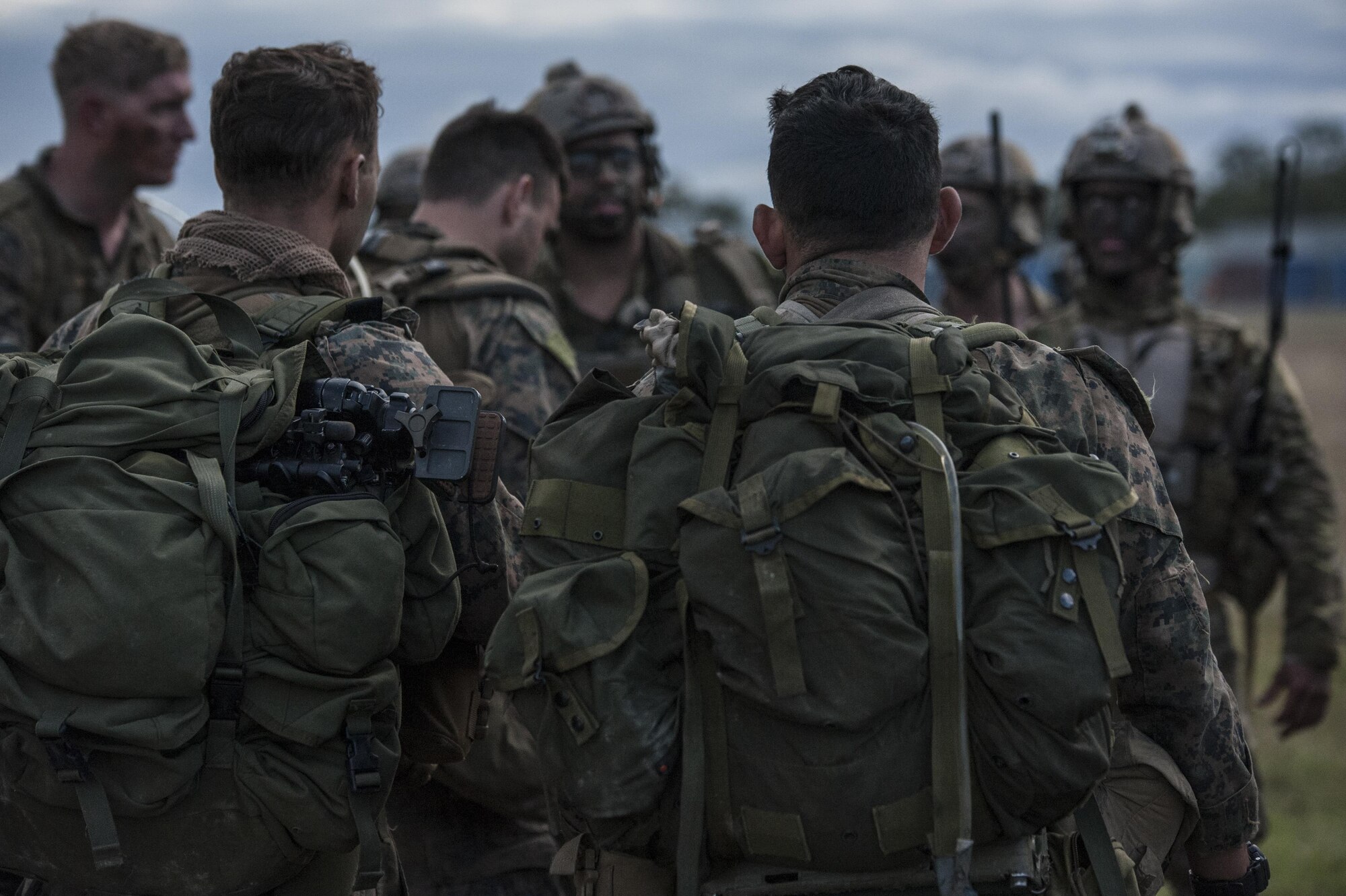 U.S. Air Force 320th Special Tactics Squadron combat controllers and U.S. Marine Corps 3rd Reconnaissance Battalion operators gather together following their extraction July 13, 2017 from Shoalwater Bay Training Area in Queensland Australia during Talisman Saber 2017. The training exercise conducted between the U.S. Air Force and Marine Corps strengthens joint interoperability and working relationship between the armed services. (U.S. Air Force photo by Capt. Jessica Tait)