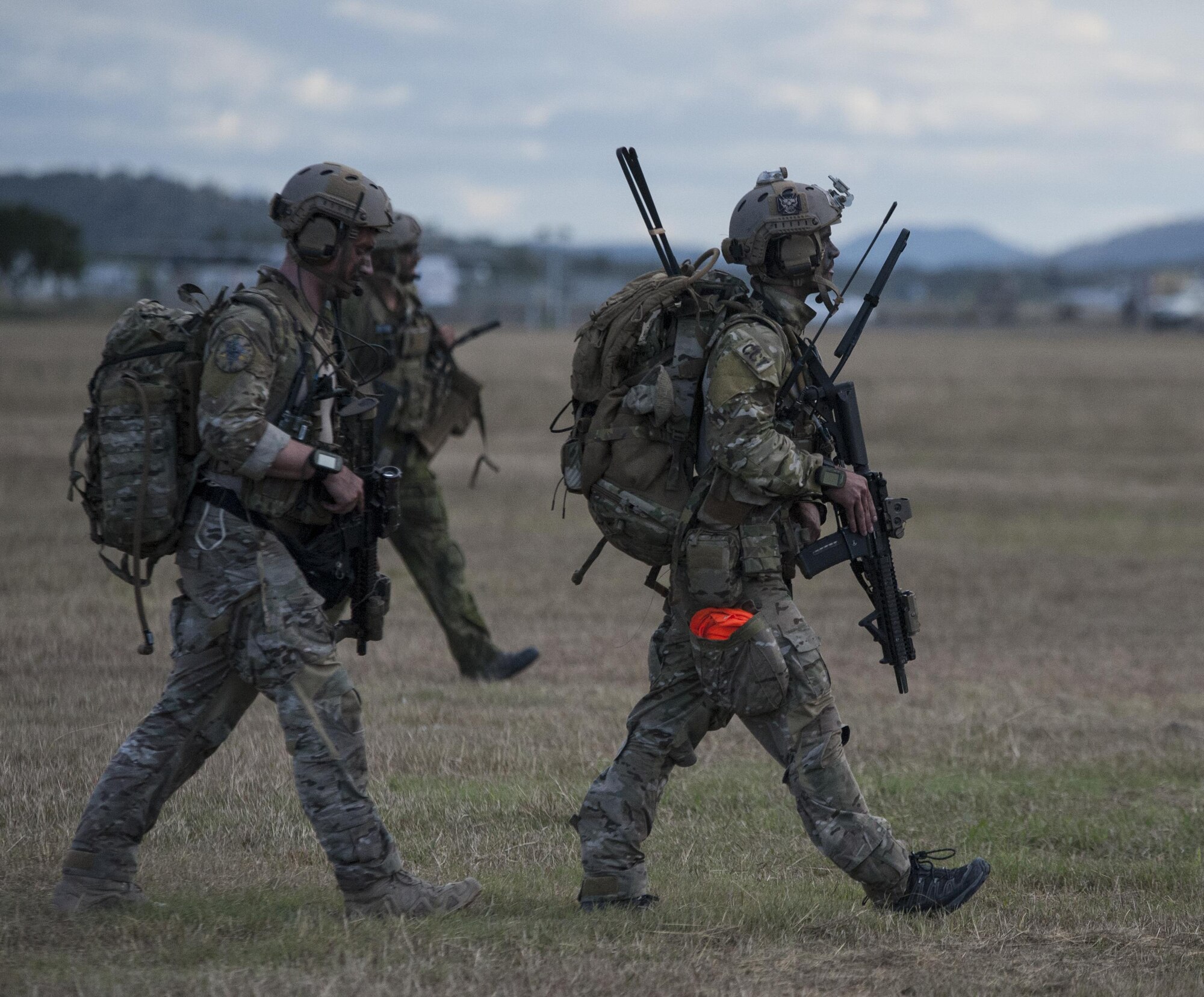 U.S. Air Force 320th Special Tactics Squadron combat controllers and U.S. Marine Corps 3rd Reconnaissance Battalion operators exit two U.S. Navy HH-60H Sea Hawk helicopters assigned to Helicopter Sea Combat Squadron-85 (HSC-85) following their extraction July 13, 2017 from Shoalwater Bay Training Area in Queensland Australia. The 320th STS operators can rapidly infiltrate into austere or hostile areas to enable airpower success in support of contingency operations. (U.S. Air Force photo by Capt. Jessica Tait)