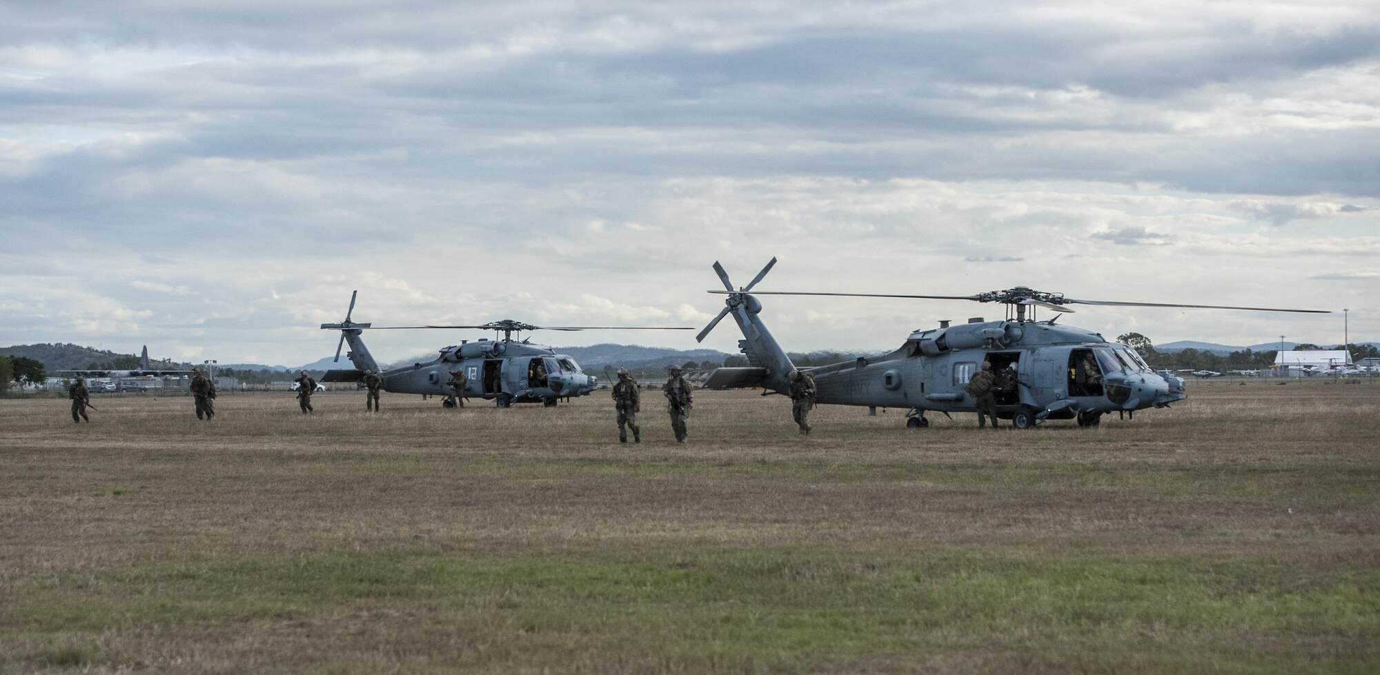 U.S. Air Force 320th Special Tactics Squadron combat controllers and U.S. Marine Corps 3rd Reconnaissance Battalion operators exit two U.S. Navy HH-60H Sea Hawk helicopters assigned to Helicopter Sea Combat Squadron-85 (HSC-85) following their extraction July 13, 2017 from Shoalwater Bay Training Area in Queensland Australia. The tactical level exchanges and realistic scenario-based missions executed during Talisman Saber 2017 increased interoperability and partner capacity with between the U.S Air Force, Navy and Marine Corps. (U.S. Air Force photo by Capt. Jessica Tait)