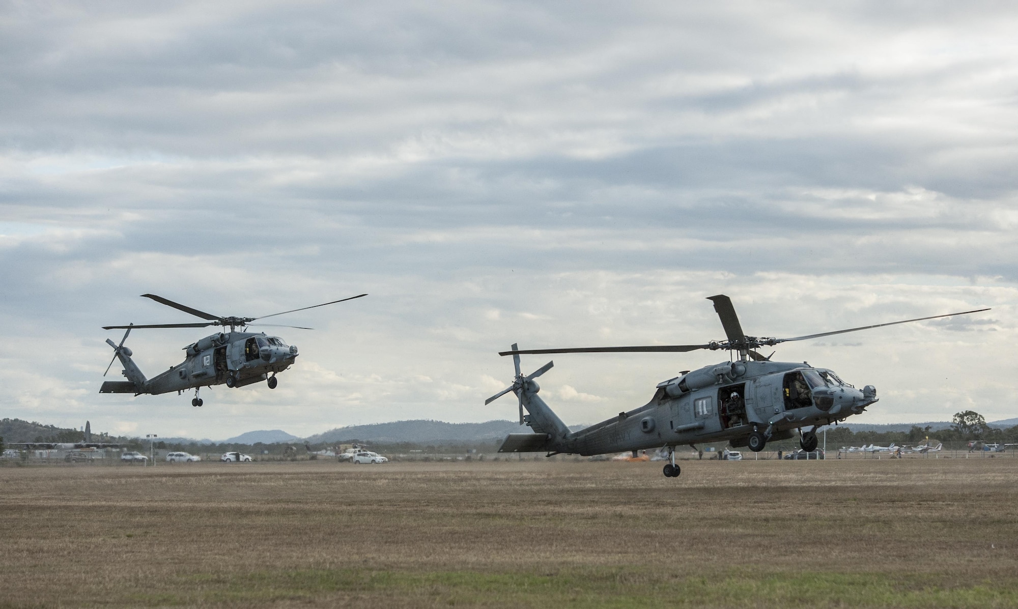 Two U.S. Navy HH-60H Sea Hawk helicopters assigned to Helicopter Sea Combat Squadron-85 (HSC-85) land at Camp Rocky in Rockhampton, Australia following the extraction of U.S. Air Force 320th Special Tactics Squadron combat controllers and U.S. Marine Corps 3rd Reconnaissance Battalion operators July 13, 2017, from Shoalwater Bay Training Area in Queensland, Australia. As the only Navy helicopter squadron dedicated to special operations support as a primary role, HSC-85 brings to the fight a unique and highly tactical rotary wing platform. (U.S. Air Force photo by Capt. Jessica Tait)