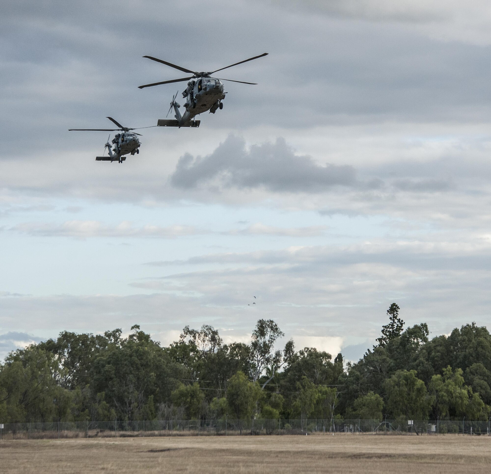 Two U.S. Navy HH-60H Sea Hawk helicopters assigned to Helicopter Sea Combat Squadron-85 (HSC-85) prepare to land at Camp Rocky in Rockhampton, Australia following the extraction of U.S. Air Force 320th Special Tactics Squadron combat controllers and U.S. Marine Corps 3rd Reconnaissance Battalion operators July 13, 2017, from Shoalwater Bay Training Area in Queensland, Australia. As the only Navy helicopter squadron dedicated to special operations support as a primary role, HSC-85 brings to the fight a unique and highly tactical rotary wing platform. (U.S. Air Force photo by Capt. Jessica Tait)