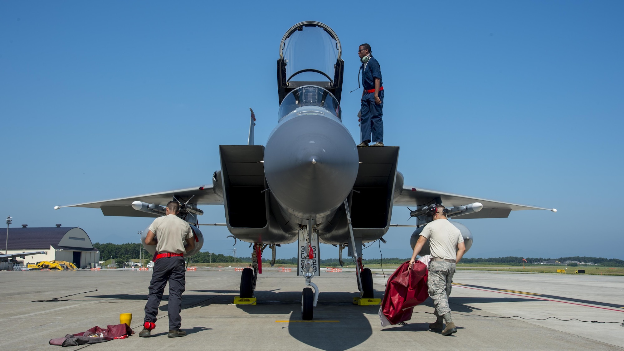 U.S. Air Force Staff Sgt. Christian Ruiz, left, an 18th Aircraft Maintenance Squadron aircraft electrical and environment technician, Senior Airman Devin Ross, center, an 18th AMXS crew chief, and Staff Sgt. Wesley Martinez, left, an 18th Component Maintenance Squadron aircrew egress systems craftsman, conducts preflight procedures on an F-15C Eagle at Misawa Air Base, Japan, June 13, 2017. Pilots and maintainers relocated from Kadena Air Base, Japan, to Misawa to conduct joint and bilateral operations with F-16 Fighting Falcons and the Japan Air Self-Defense Force’s F-2s. (U.S. Air Force photo by Staff Sgt. Deana Heitzman)