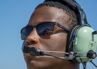 U.S. Air Force Senior Airman Devin Ross, an 18th Aircraft Maintenance Squadron crew chief, speaks with Capt. David Kuhn, a 67th Fighter Squadron F-15C Eagle pilot, during preflight check at Misawa Air Base, Japan, June 13, 2017. Airmen and pilots from Kadena Air Base, Japan, and the 35th Fighter Wing, worked closely with Japan Air Self-Defense Force pilots to strengthen their bilateral partnership across the Indo-Asia-Pacific region. (U.S. Air Force photo by Staff Sgt. Deana Heitzman)