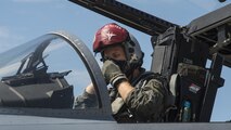 U.S. Air Force Capt. David Kuhn, a 67th Fighter Squadron F-15C Eagle pilot, dons his oxygen mask prior to flight at Misawa Air Base, Japan, June 13, 2017. Pilots and maintainers from Kadena Air Base, Japan, relocated to Misawa Air Base, Japan, due to its strategic location, ensuring contingency operations for airframes and units forward deployed across the Indo-Asia-Pacific region. (U.S. Air Force photo by Staff Sgt. Deana Heitzman)