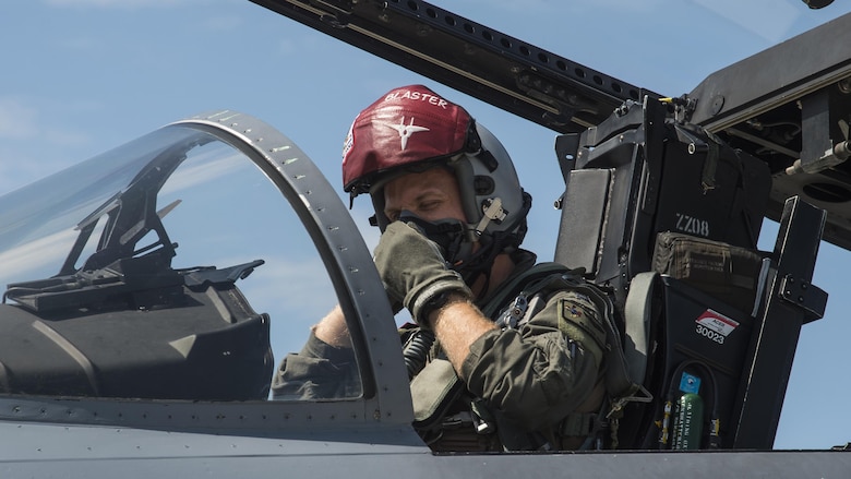 U.S. Air Force Capt. David Kuhn, a 67th Fighter Squadron F-15C Eagle pilot, dons his oxygen mask prior to flight at Misawa Air Base, Japan, June 13, 2017. Pilots and maintainers from Kadena Air Base, Japan, relocated to Misawa Air Base, Japan, due to its strategic location, ensuring contingency operations for airframes and units forward deployed across the Indo-Asia-Pacific region. (U.S. Air Force photo by Staff Sgt. Deana Heitzman)