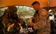 Airman 1st Class Tyler Fleetwood, 647th Civil Engineering Squadron emergency management journeyman, double checks participants’ mission oriented protective posture gear during a readiness exercise, at Base X on Joint Base Pearl Harbor-Hickam, Hawaii, July 6, 2017. CBRNE training is a requirement for deployment preparation.  The training teaches service members how to operate in a chemical environment. (U.S. Air Force photo by Tech. Sgt. Heather Redman)