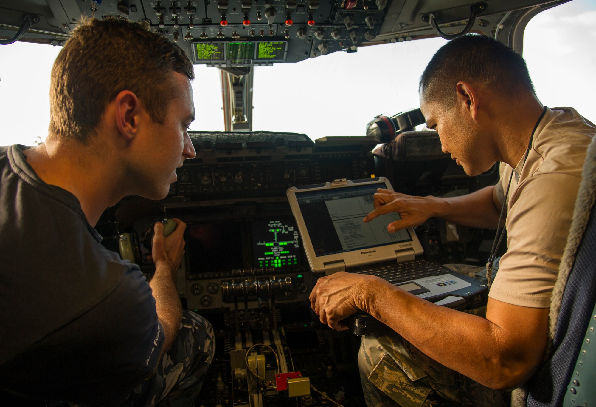 Royal Australian Air Force Cpl. Sebastian Devine,  36th Squadron from Royal Australian Air Force Base Amberley, and U.S. Air Force Tech. Sgt. Joel Membrere, 154th Maintenance Squadron, flush the breaks on a C-17 Globemaster III, on Joint Base Pearl Harbor-Hickam, Hawaii, July 12, 2017.  The Airmen came together for a week long combined Enhanced Air Cooperation training event designed to integrate maintenance capabilities between the U.S. and Australia.  (U.S. Air Force photo by Tech. Sgt. Heather Redman)