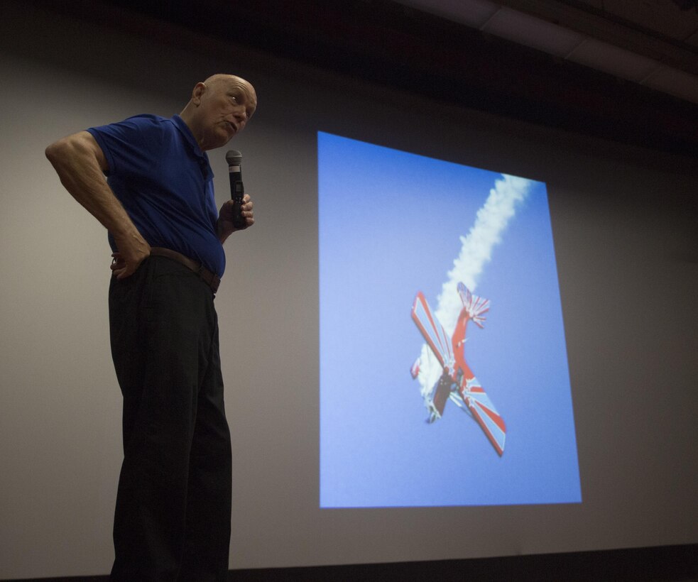 Dr. Story Musgrave conducts a professional military education seminar at the base theater aboard Marine Corps Base Hawaii July 7, 2017. Musgrave spoke to Marines of Marine Aircraft Group 24 about his career as a Marine, and his subsequent success as a pilot, scholar, scientist, and astronaut. (U.S. Marine Corps photo by Lance Cpl. Luke Kuennen)