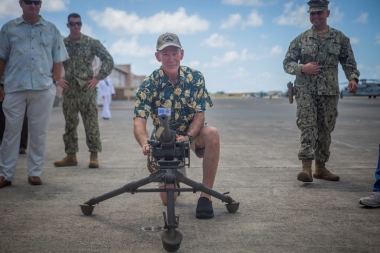 MARINE CORPS AIR STATION KANEOHE BAY - One of John Finn’s family members tests out a replica of the machine gun Finn used to defend his hangar during the attack on Pearl Harbor as part of a tour aboard Marine Corps Base Hawaii July 14, 2017. The tour allowed family members to explore the legacy left by Finn after carrying out the feats of heroism that earned himself the first Medal of Honor of WWII. (U.S. Marine Corps Photo by Cpl. Zachary Orr)