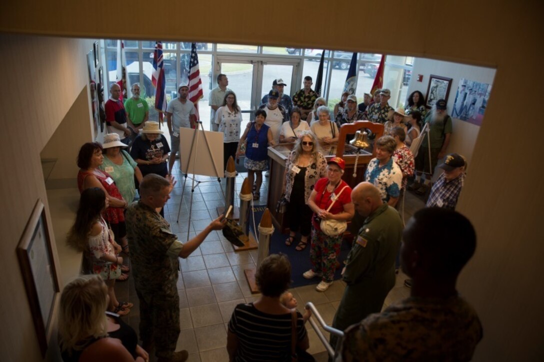 MARINE CORPS BASE HAWAII - Col. Christopher Patton, the commanding officer of Marine Aircraft Group 24, addresses the family of John Finn at the John Finn Memorial Building aboard Marine Corps Base Hawaii July 14, 2017. The tour allowed family members to explore the legacy left by Finn after carrying out the feats of heroism that earned himself the first Medal of Honor of WWII. (U.S. Marine Corps Photo by Lance Cpl. Luke Kuennen)
