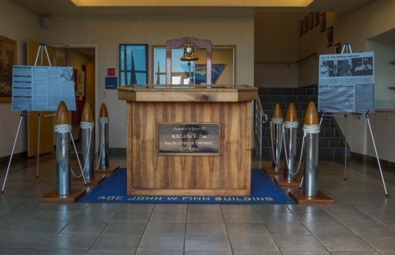 MARINE CORPS BASE HAWAII - A display is set at the John Finn Memorial Building for the Finn family’s tour aboard Marine Corps Base Hawaii July 14, 2017. The tour allowed family members to explore the legacy left by Finn after carrying out the feats of heroism that earned himself the first Medal of Honor of WWII. (U.S. Marine Corps Photo by Cpl. Zachary Orr)