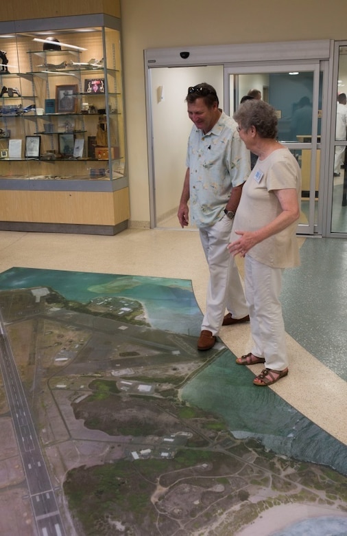 MARINE CORPS AIR STATION KANEOHE BAY - Members of John Finn’s family tour pause to examine the map of the surrounding area on the floor at Marine Corps Air Station, Kaneohe Bay aboard Marine Corps Base Hawaii July 14, 2017. The tour allowed family members to explore the legacy left by Finn after carrying out the feats of heroism that earned himself the first Medal of Honor of WWII. (U.S. Marine Corps Photo by Cpl. Zachary Orr)