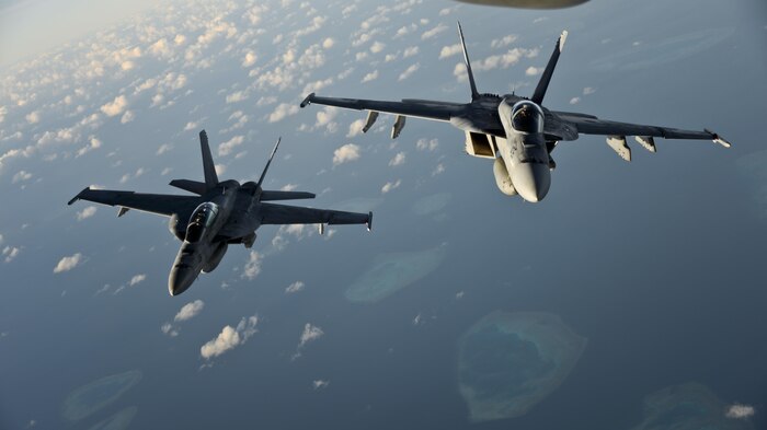 A KC-10 Extender from Travis Air Force Base, California, prepares to refuel another KC-10 over the Pacific Ocean July 14, 2017. KC-10s from Travis AFB supported Exercise Talisman Saber 2017 by conducting various air refueling missions over Australia. TS17 is a biennial exercise in Australia that focuses on bilateral military training between U.S. Pacific Command forces and the Australian Defence Force to improve U.S.-Australia combat readiness, increase interoperability, maximize combined training opportunities and conduct maritime prepositioning and logistics operations in the Pacific. (U.S. Air Force photo by 2nd Lt. Sarah Johnson)
