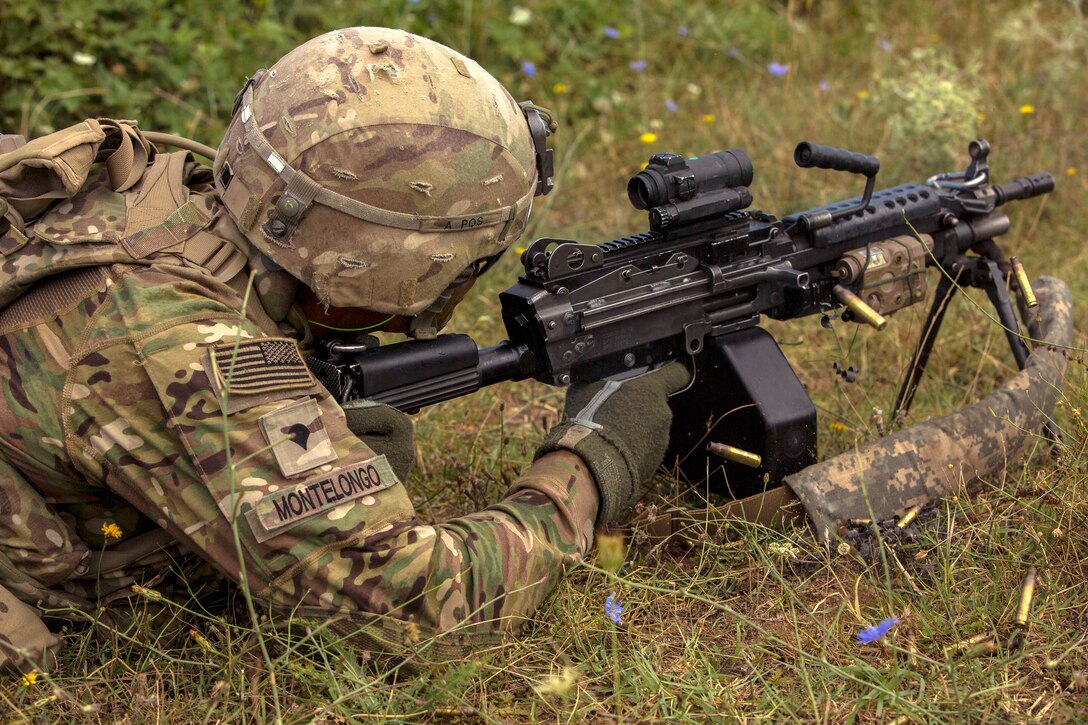 A soldier fires a M249 squad automatic weapon during urban operations training as part of exercise Saber Guardian 17 in Koren, Bulgaria, July 15, 2017. The soldier is assigned to the 4th Infantry Division’s 1st Battalion, 8th Infantry Regiment, 3rd Armored Brigade Combat Team. Army photo by Spc. Winterlyn Patterson