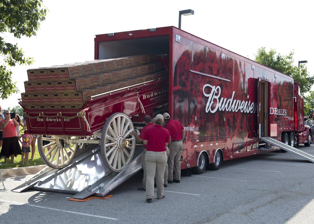 The Budweiser Clydesdales wagon is unloaded from a tractor trailer July 16, 2017, at Dover Air Force Base, Del. The wagon is a Studebaker wagon modified to carry beer and was originally manufactured in 1903. (U.S. Air Force photo by Senior Airman Zachary Cacicia)