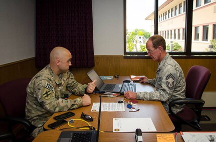 U.S. Air Force Lt. Col Roger Brooks, left, PATRIOT exercise
director, and Chief Master Sgt. Robert Newell, PATRIOT exercise Logistics
manager, discuss details Jul. 15, 2017, of the upcoming PATRIOT North
exercise, at Volk Field, Wis.