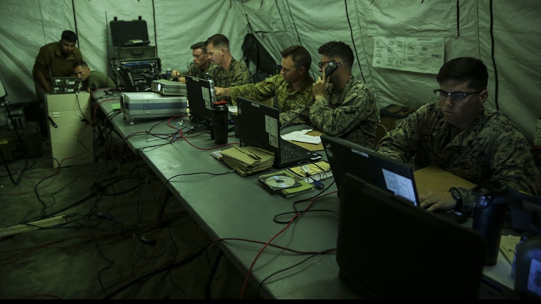 Marines with Marine Tactical Air Command Squadron 38 work inside the smaller tactical air direction center, during exercise HYDRA 1-17, at East Miramar, California, June 6. HYDRA 1-17 simulated ship-to-shore movement by employing a TADC and integrated with a Navy tactical air control center. A TADC is a task-organized site which performs all or most of the Marine TACC functions but is employed in a subordinate role. 
