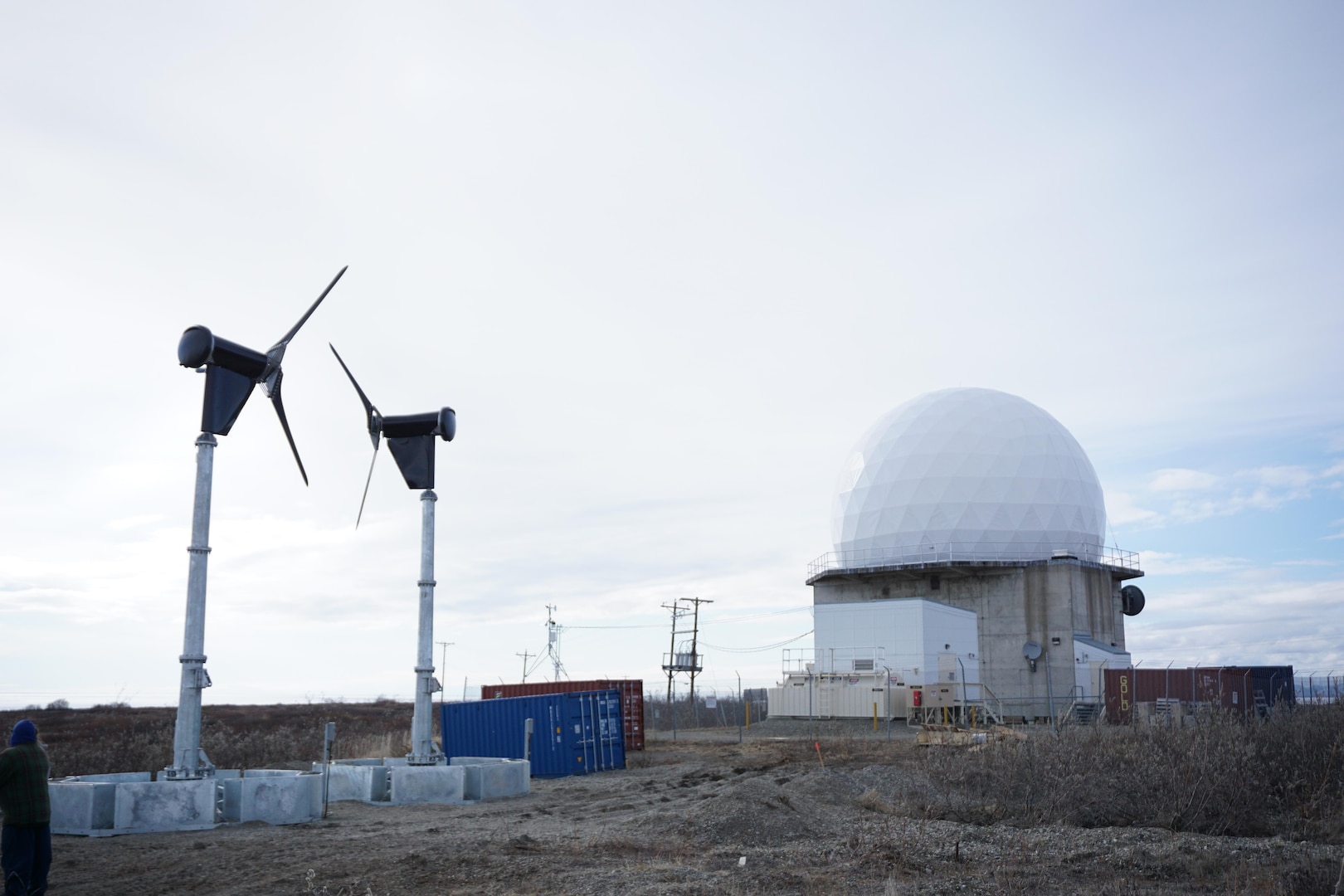 These energy-harvesting wind turbines in Kotzebue, Alaska, are part of the Energy Assurance at Remote Radar Sites project, a one-year effort managed by the AFRL Advanced Power Technology Office to demonstrate rapidly-deployable, off-grid energy technologies for increased mission energy resiliency in remote locations.  (U.S. Air Force photo/Capt Jason Goins)