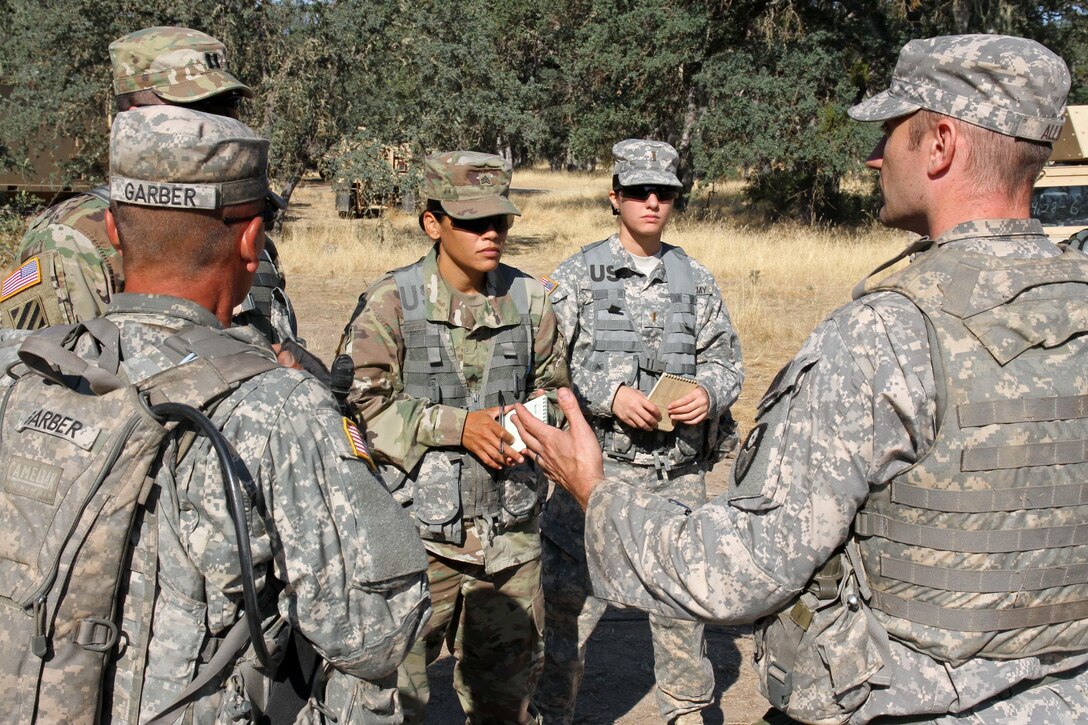 Soldiers from the 149 Chemical, Biological, Radiological, Nuclear (CBRN) Company, 49th Military Police Brigade, California Army National Guard, discuss pre-mission troop leading procedures with their U.S. Army Reserve Observer Controller/Trainers (OC/Ts), middle, from the 91st Training Division, 84th Training Command, during a Combat Support Training Exercise (CSTX) at Fort Hunter Liggett, Calif., July 12, 2017. OC/T's are overseeing nearly 5,400 service members from the U.S. Army Reserve, U.S. Army, Army National Guard, U.S. Navy, and Canadian Armed Forces training at Fort Hunter Liggett as part of the 84th Training Command's CSTX 91-17-03; this is a unique training opportunity that allows U.S. Army Reserve units to observe, control and train alongside their multi-component and joint partners as part of the America's Army Reserve evolution into the most lethal Federal Reserve force in the history of the nation. (U.S. Army Reserve photo by Sgt. 1st Class Joy Dulen)