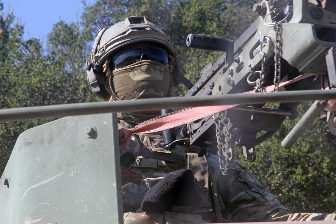 Cpl. Ryan Clay, a Chemical, Biological, Radiological, Nuclear (CBRN) specialist with the 149 CBRN Company, 49th Military Police Brigade, California Army National Guard, mans a M2 .50 caliber machine gun from the turret of the lead humvee in a convoy during a Combat Support Training Exercise (CSTX) at Fort Hunter Liggett, Calif., July 12, 2017. Nearly 5,400 service members from the U.S. Army Reserve, U.S. Army, Army National Guard, U.S. Navy, and Canadian Armed Forces are training at Fort Hunter Liggett as part of the 84th Training Command's CSTX 91-17-03; this is a unique training opportunity that allows U.S. Army Reserve units to train alongside their multi-component and joint partners as part of the America's Army Reserve evolution into the most lethal Federal Reserve force in the history of the nation. (U.S. Army Reserve photo by Sgt. 1st Class Joy Dulen)