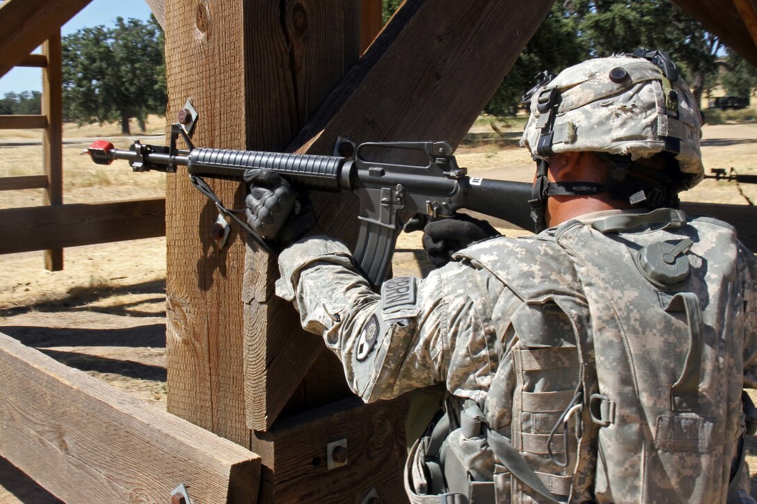 Sgt. Nestor Morales, a Chemical, Biological, Radiological, Nuclear (CBRN) specialist with the 149 CBRN Company, 49th Military Police Brigade, California Army National Guard, returns fire at opposing forces attacking his unit's tactical assembly area during a Combat Support Training Exercise (CSTX) at Fort Hunter Liggett, Calif., July 12, 2017. Nearly 5,400 service members from the U.S. Army Reserve, U.S. Army, Army National Guard, U.S. Navy, and Canadian Armed Forces are training at Fort Hunter Liggett as part of the 84th Training Command's CSTX 91-17-03; this is a unique training opportunity that allows U.S. Army Reserve units to train alongside their multi-component and joint partners as part of the America's Army Reserve evolution into the most lethal Federal Reserve force in the history of the nation. (U.S. Army Reserve photo by Sgt. 1st Class Joy Dulen)