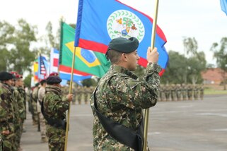 Multinational special forces teams line up at the opening ceremony for Fuerzas Comando 2017 in Mariano Roque Alonso, Paraguay on July 17, 2017. Fuerzas Comando is a fellowship program that promotes military-to-military relationships for all teams involved. (U.S. Army photo by Sgt. Christine Lorenz/Released)