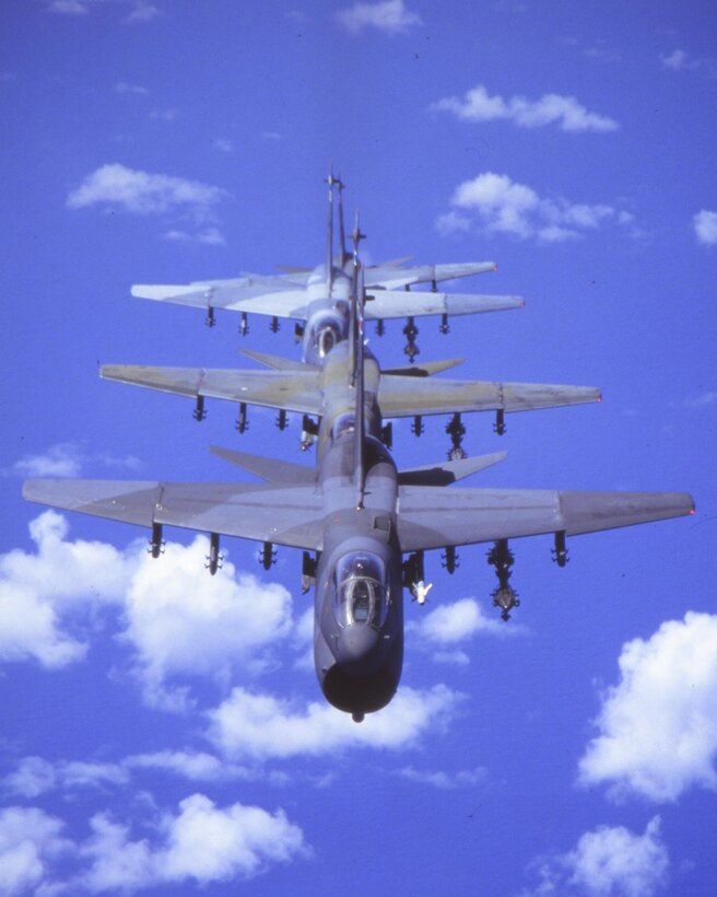 Four A-7D Corsair IIs of the 198th Fighter Squadron, 156th Fighter Group, Puerto Rico Air National Guard, fly in-trail formation over the Caribbean in 1992. 