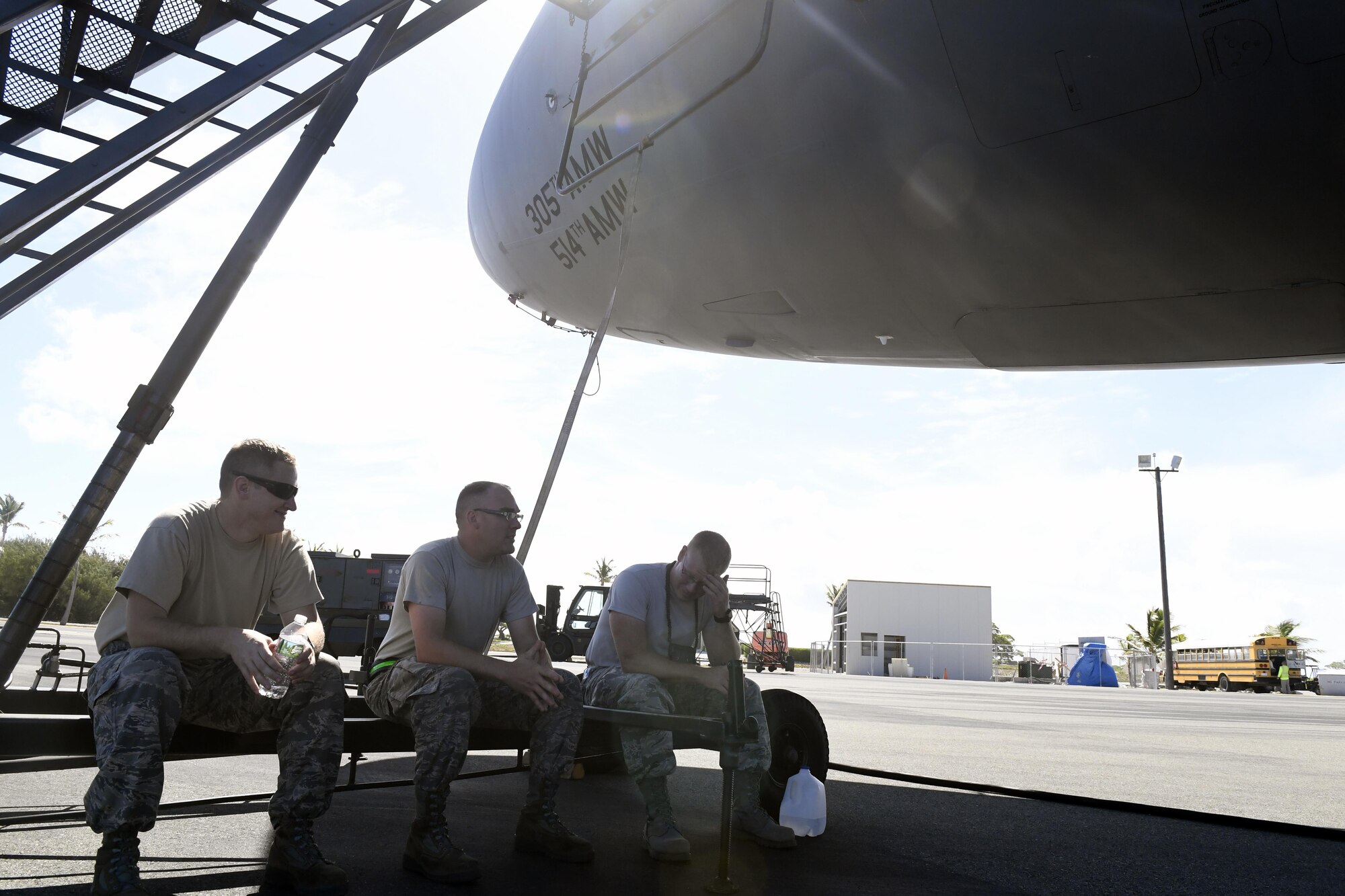 Maintainers from Joint Base MDL take a break after inspecting and refueling three KC-10 Extender aircraft following the in-flight refueling of C-17 Globemaster III en route from Alaska to Australia on Wake Island, July 11, 2017. The maintainers were responsible for ensuring the KC-10 Fleet from Joint Base MDL could successfully refuel aircraft over Wake Island in the Pacific.

